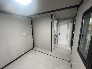 Expandable Folding House with Sloping Roof